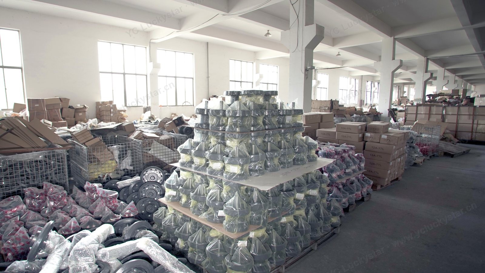 Parts warehouse interior — shelves stocked with packed orders